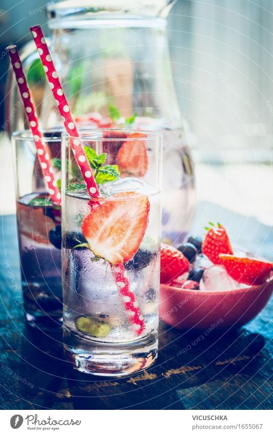 Water with berries in glass Food Fruit Beverage Cold drink Drinking water Lemonade Glass Style Design Healthy Healthy Eating Life Cure Table Berries Water jug