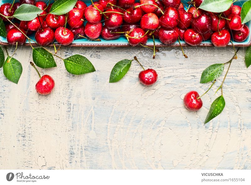 Sweet cherries with green leaves on light wood Food Fruit Nutrition Organic produce Vegetarian diet Style Design Healthy Eating Life Summer Garden Table Nature