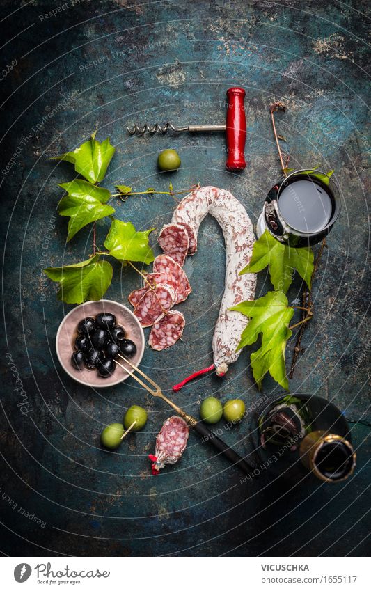 Italian food with salami, red wine, vine leaves and olives Food Sausage Nutrition Lunch Buffet Brunch Picnic Italian Food Beverage Wine Plate Bowl Bottle Glass