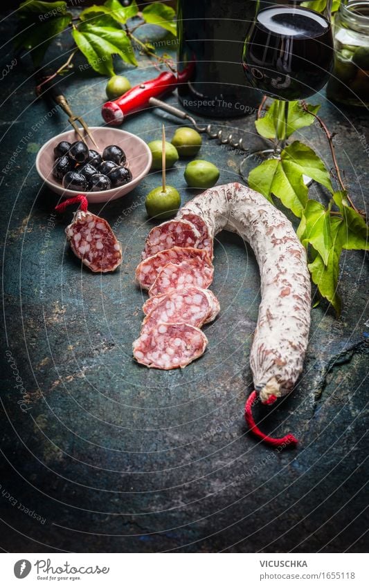 Sliced salami with antipasti, red wine and vine leaves Food Sausage Vegetable Nutrition Lunch Buffet Brunch Banquet Italian Food Beverage Wine Bowl Bottle Glass