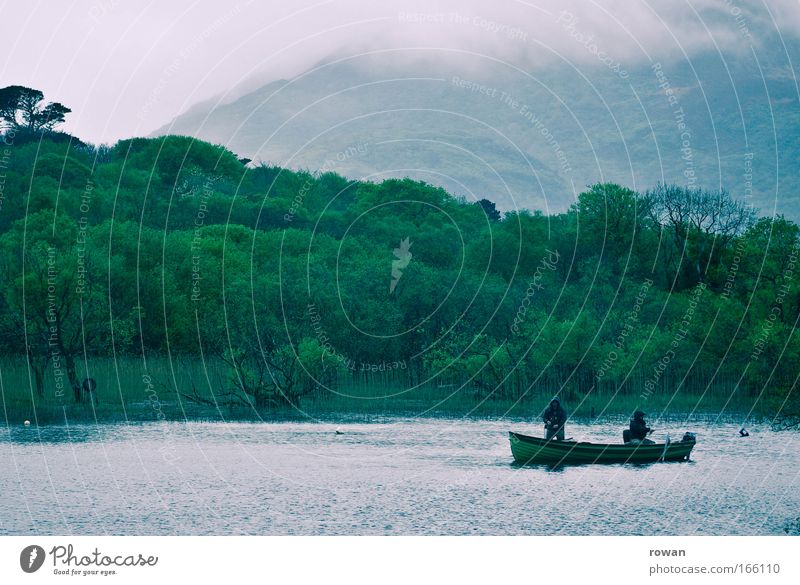 patience Colour photo Subdued colour Copy Space top Fishing (Angle) Wait Wet Cold Patient Watercraft Lake Lakeside Rain Fog Green Mountain lake Angler