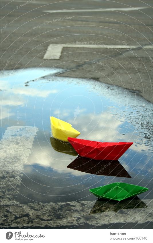 wreck Colour photo Deserted Day Water Wet Yellow Green Red Joy Paper Paper boat Playing Reflection Lake Parking lot Puddle Float in the water Swimming & Bathing