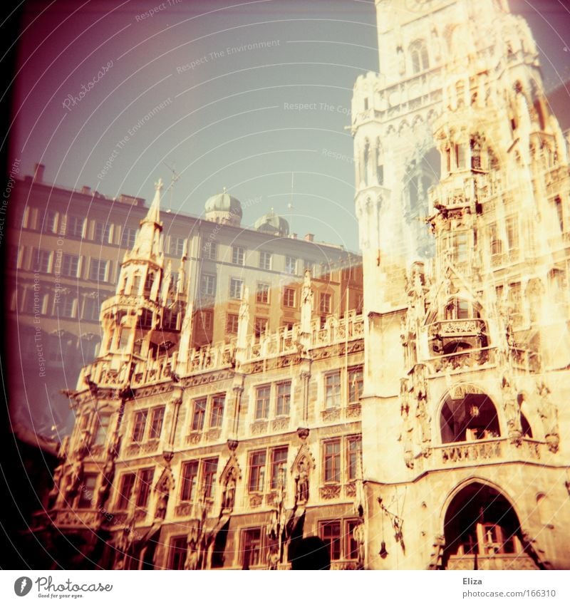 Analogue double exposure of the Munich City Hall with the towers of the Frauenkirche on it on the Marienplatz Old town City hall Tourist Attraction Threat