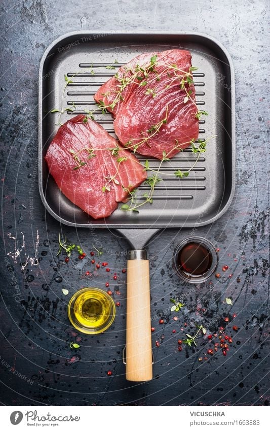 Grill pan with two raw tuna steaks Food Fish Herbs and spices Cooking oil Nutrition Lunch Dinner Buffet Brunch Banquet Business lunch Organic produce