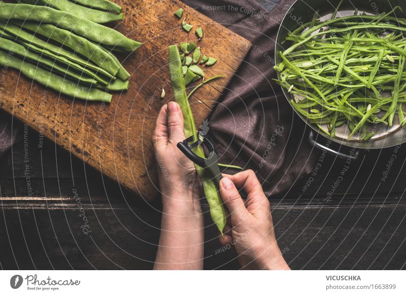 Female hands cut beans with vegetable peeler . Food Vegetable Nutrition Lunch Dinner Organic produce Vegetarian diet Diet Pot Knives Style Healthy Eating Life