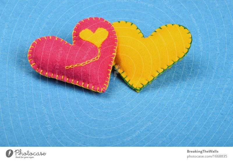two handmade FELT hearts, pink and yellow together on blue Leisure and hobbies Handcrafts Valentine's Day Wedding Art Work of art Toys Heart Love Together Small
