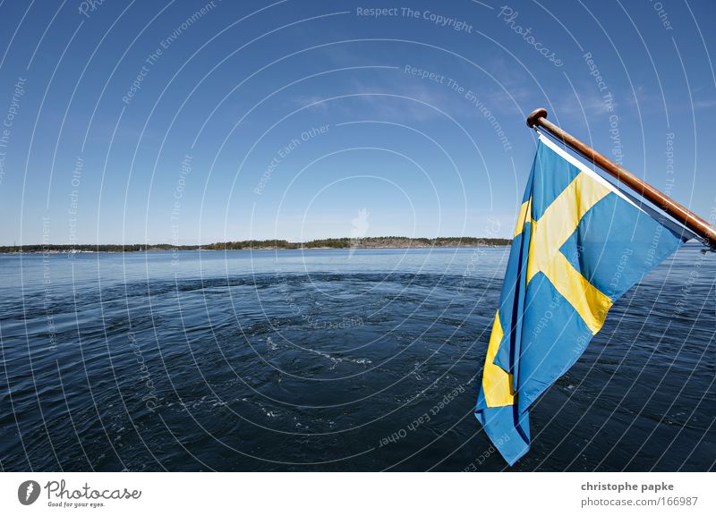 Swedish flag, in the background water and islands of the archipelago off Stockholm Swede Flag Skerry archipelago garden Scandinavia Landscape Island Fjord Trip