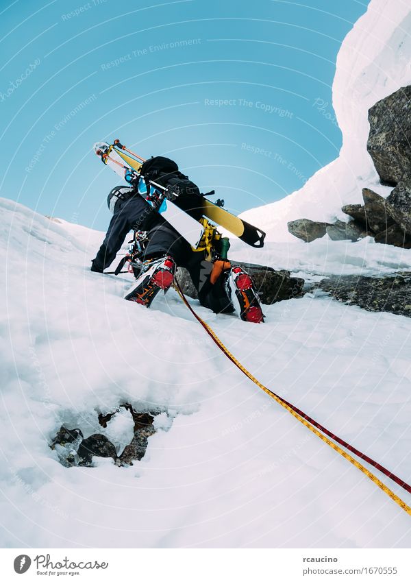 Ice climbing: mountaineer on a mixed route of snow and rock Joy Vacation & Travel Adventure Expedition Winter Snow Mountain Sports Climbing Mountaineering