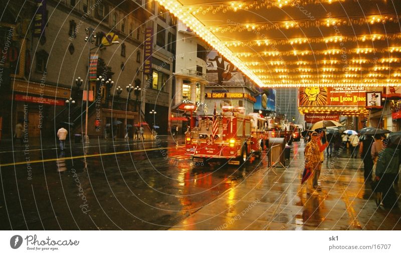 Fire brigade in NY Wet New York City Fire department Lion King light blanket Morning FDNY Deployment Road traffic Alarm Bad weather City light