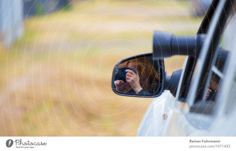 a woman photographed out of a car Profession "Photographer Detective Human being Feminine Woman Adults Motoring Street Car Red-haired Observe Relationship