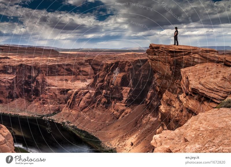 Deep abyss Vacation & Travel Adventure Woman Adults 1 Human being Nature Landscape Sky Storm clouds Horizon Rock Canyon Glen Canyon Grand Canyon Horseshoe Bend