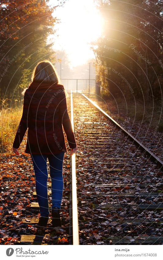 young woman walking next to the tracks towards the sunset Human being Feminine Young woman Youth (Young adults) Woman Adults Life 1 Environment Nature Landscape