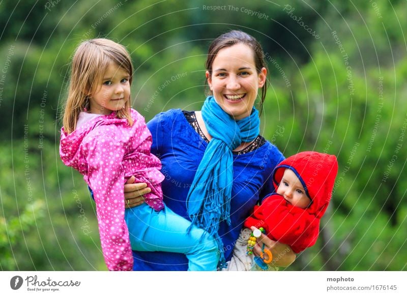 Mother with two small children in her arms Joy Happy Life Parenting Kindergarten Child Profession Kindergarten teacher Human being Feminine Baby Toddler Girl