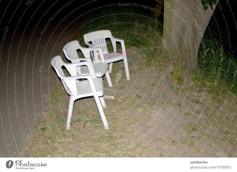 First row Chair Sit Row Row of seats Garden Garden chair Camping Camping chair Stack Plastic chair Evening Night Flash photo Copy Space Deserted Empty Audience