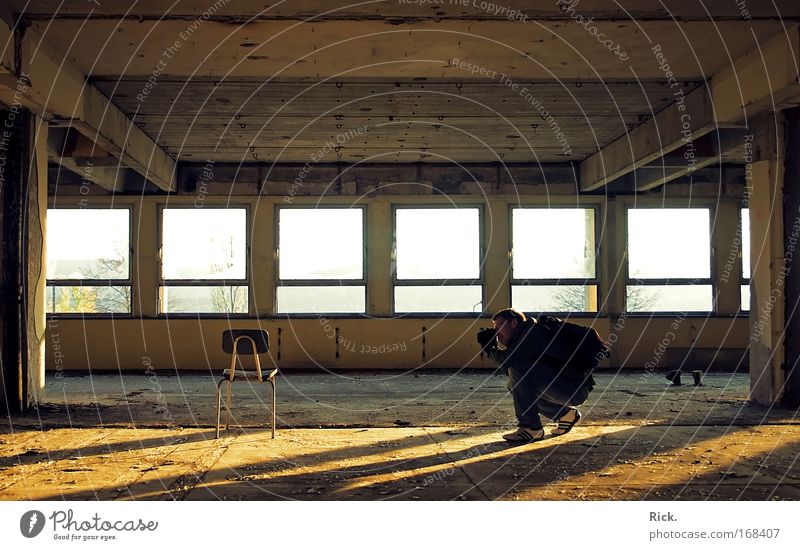 The Magic Chair. Colour photo Interior shot Day Light Shadow Contrast Silhouette Sunlight Sunbeam Sunrise Sunset Central perspective Looking into the camera