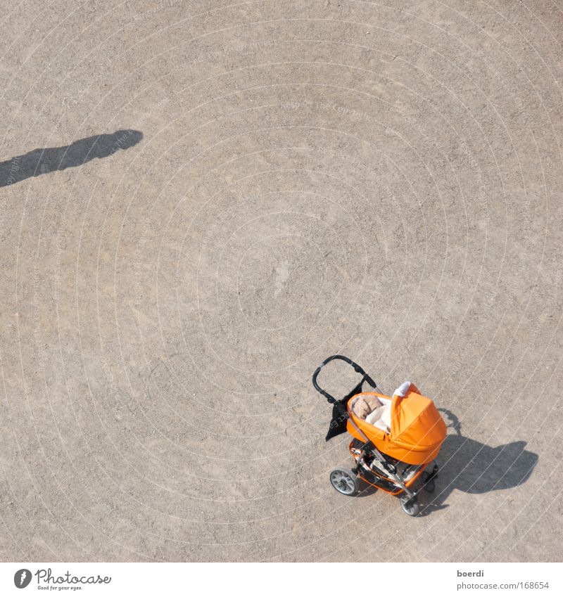 RENEWS Colour photo Exterior shot Close-up Aerial photograph Day Shadow Deep depth of field Bird's-eye view Human being 1 Vehicle Baby carriage Sand Stand Wait