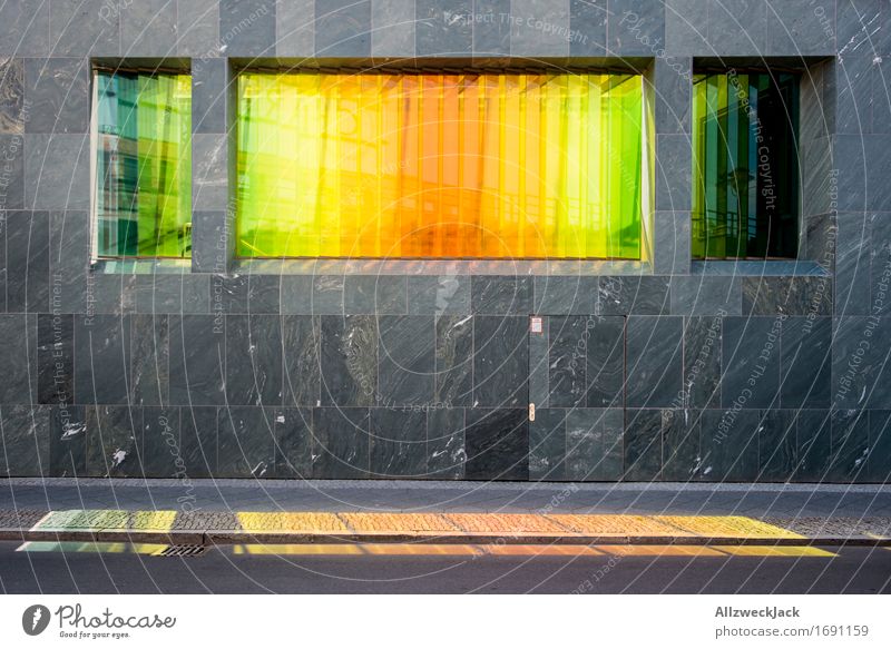 variegated Capital city Architecture Facade Prismatic colors Rainbow Yellow Green Red coloured glass Pane Window Blaze of colour Play of colours