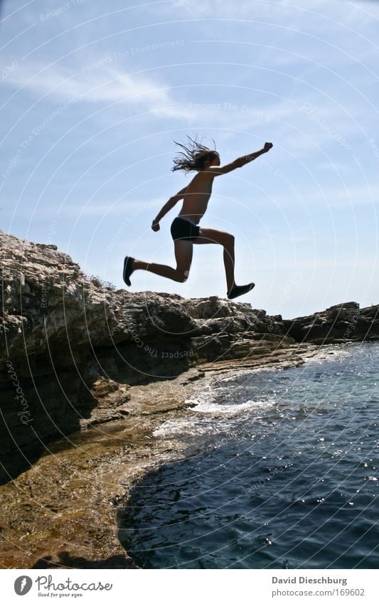 Jump into the blue Colour photo Exterior shot Day Shadow Contrast Silhouette Full-length Profile Looking away Human being Man Adults Arm Legs Nature Landscape