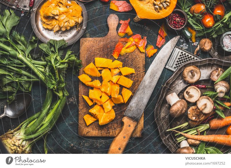 Chopped pumpkin on rustic chopping board with kitchen knife Food Vegetable Herbs and spices Nutrition Lunch Dinner Banquet Organic produce Vegetarian diet Diet