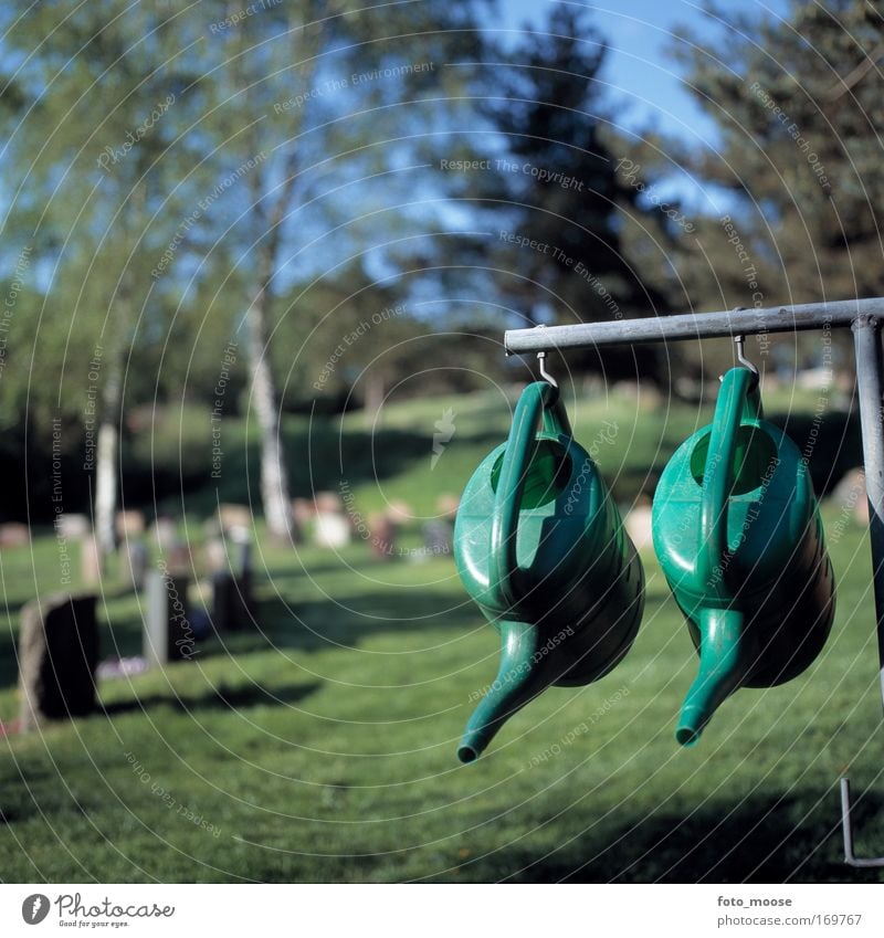 Watering Post Colour photo Exterior shot Deserted Day Shallow depth of field Garden Summer Watering can Plastic Hang Green Peaceful Calm Death Esthetic