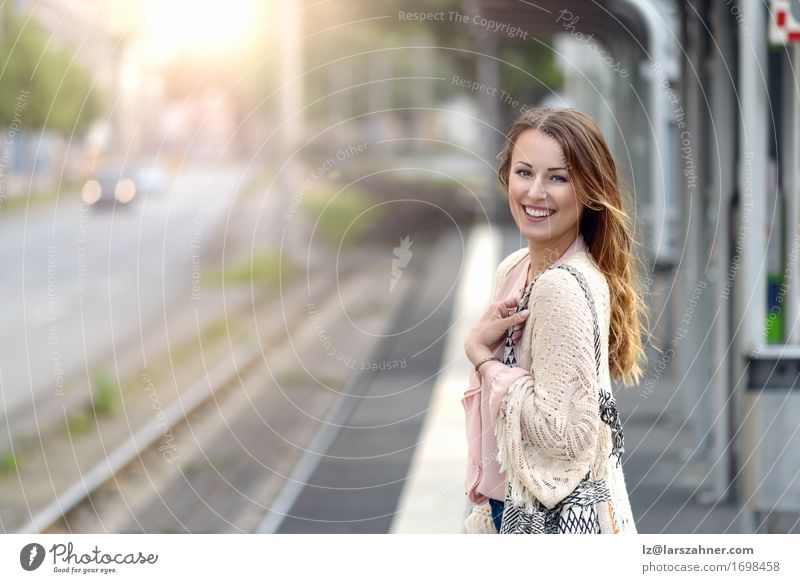 Stylish young woman waiting on a platform Lifestyle Happy Beautiful Face Summer Technology Feminine Woman Adults 1 Human being 18 - 30 years