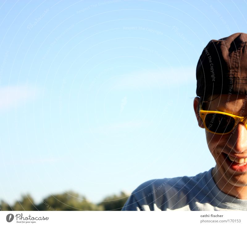 yellow glasses Colour photo Exterior shot Day Light Shadow Contrast Sunlight Central perspective Portrait photograph Downward Joy Summer Human being Masculine