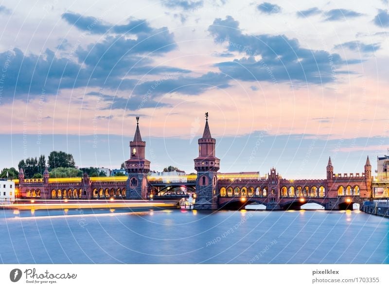 Oberbaum bridge with subway and boat at night Vacation & Travel Tourism Sightseeing City trip Water Clouds Sunrise Sunset River Spree Berlin Oberbaum City