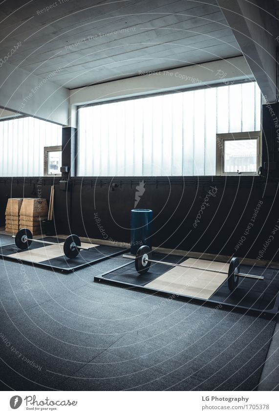 Interior shot of a weightlifting and crossfit gym Body Wellness Club Disco Sports Fitness Strong Power bar bell Body building equipment Practice Story Gymnasium