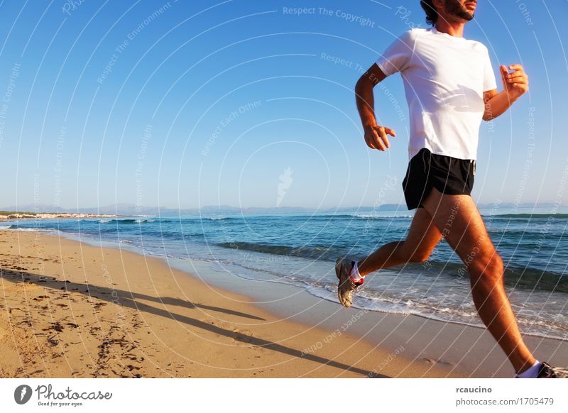 Man running at sunset on a sandy beach in a sunny day Lifestyle Body Relaxation Vacation & Travel Summer Beach Ocean Sports Jogging Human being Adults Nature