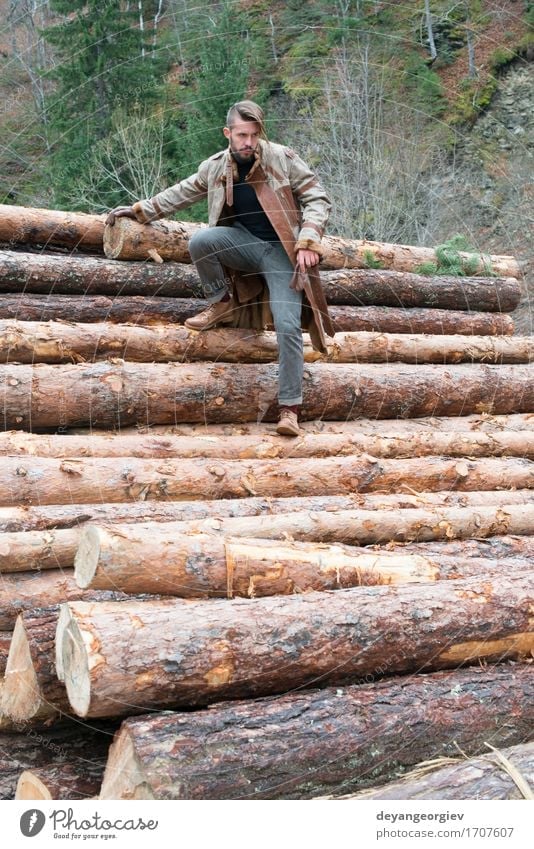 Young men on logs in the forest. Leather and jeans Lifestyle Happy Summer Human being Boy (child) Man Adults Nature Tree Forest Fashion Jeans Footwear Think