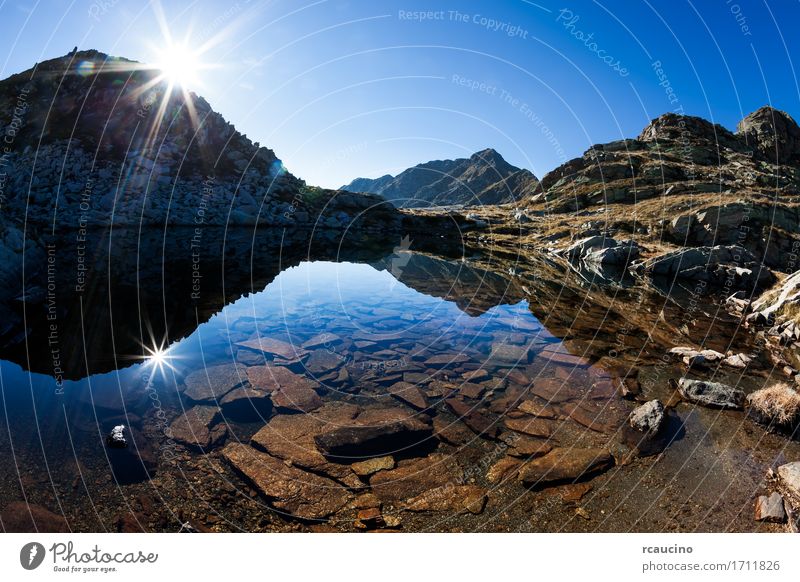 Small mountain lake in a sunny autumn day Vacation & Travel Summer Sun Mountain Nature Landscape Sky Autumn Alps Pond Lake Lanes & trails Blue Green White