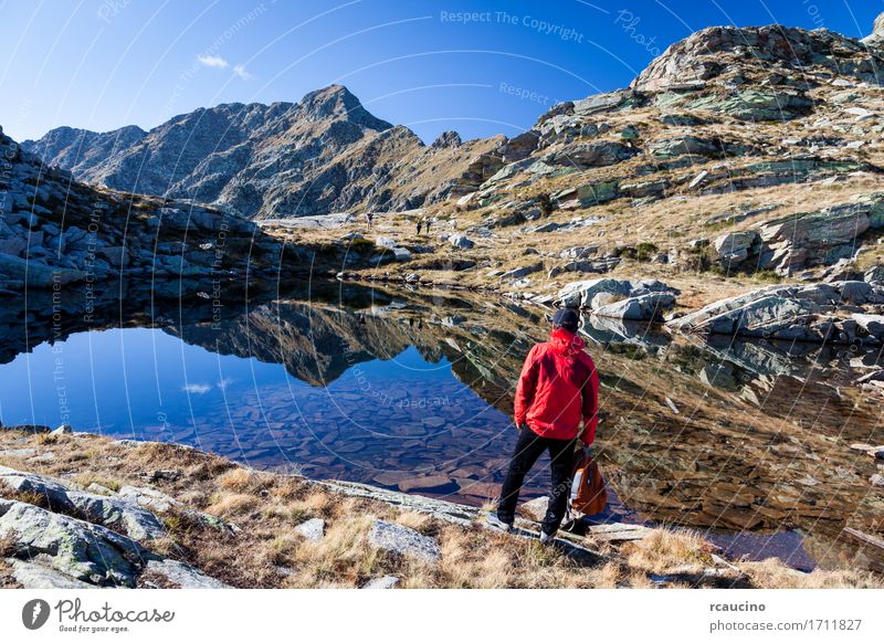 Male hiker near a small mountain lake. Meditation Vacation & Travel Tourism Trip Adventure Expedition Summer Mountain Sports Human being Man Adults Nature