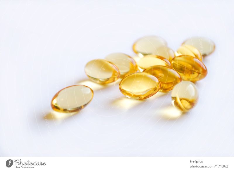 golden capsules Close-up Neutral Background Shallow depth of field Healthy Health care Science & Research Capsule Pill drug addiction Dependence Gold