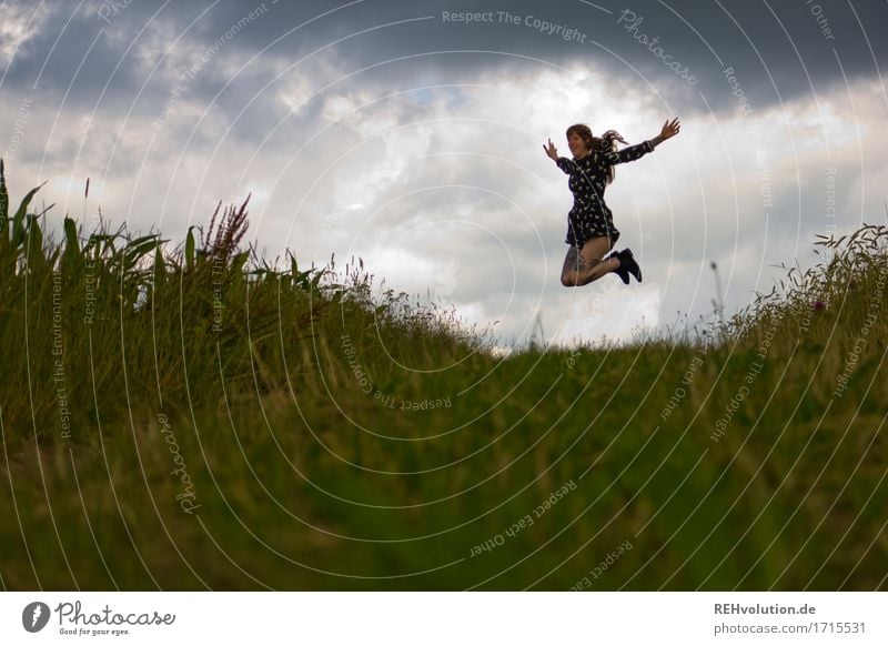 Carina jumps. Human being Feminine Young woman Youth (Young adults) 1 18 - 30 years Adults Environment Nature Landscape Sky Storm clouds Bad weather Meadow