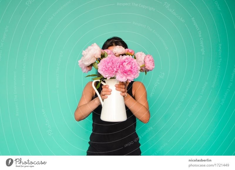 Woman holding vase with flowers in front of her face Lifestyle Style pretty Fragrance Arrange Interior design Decoration Feasts & Celebrations Valentine's Day