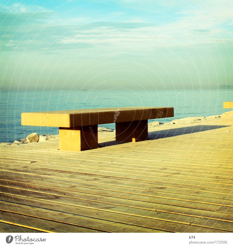 bench Bench Empty Loneliness Deserted Horizon Ocean Lake Wood Footbridge Calm Far-off places Light Shadow Colour Yellow Blue Simplistic Simple Minimal