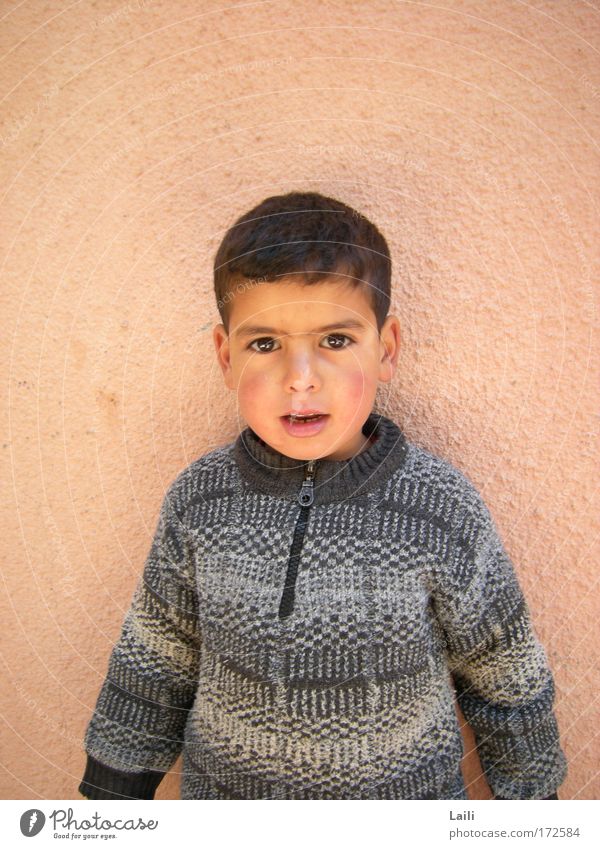 Berber boy Colour photo Exterior shot Copy Space left Copy Space right Morning Central perspective Portrait photograph Looking Looking into the camera