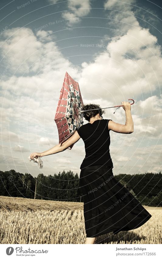 young woman in black points with umbrella to the left in front of cloudy sky Lifestyle Elegant Style Joy luck already Human being Feminine Young woman