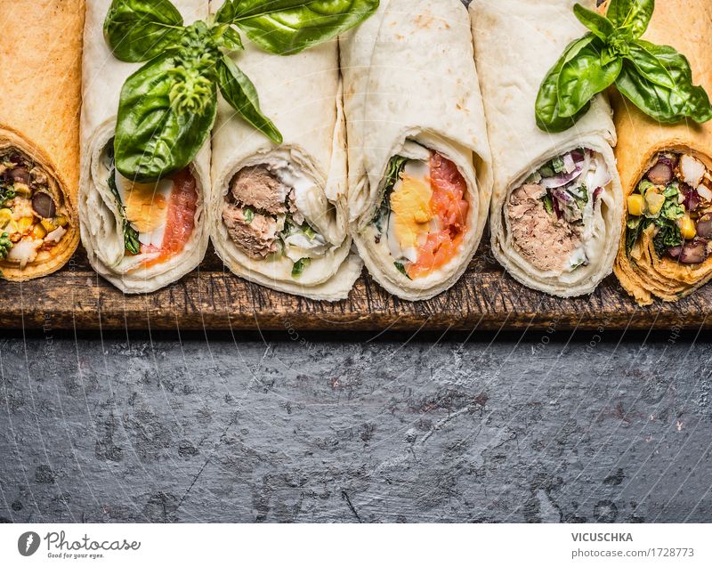 Delicious tortilla wraps on a dark background Food Fish Vegetable Bread Nutrition Lunch Buffet Brunch Picnic Organic produce Vegetarian diet Diet Style Design