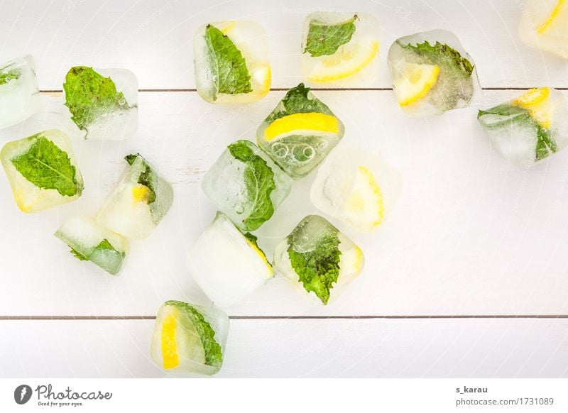Summer ice cubes Background picture Copy Space Ice Ice cube Mint Lemon Yellow Green Leaf Seasons Cold Cooling Refreshment Warmth Beverage Fresh Sense of taste