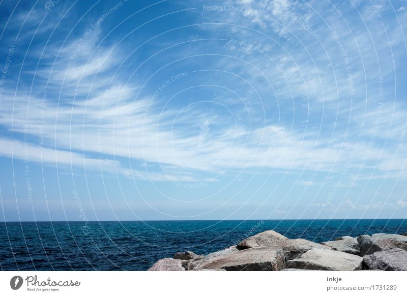 a long while by the sea Environment Water Sky Horizon Summer Beautiful weather Coast Ocean Stone Blue Far-off places Cloud pattern Rock Calm Colour photo