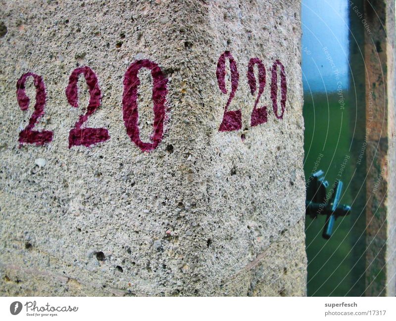 220 / 220 Door Water pipe Historic red digits. concrete Stone Corner