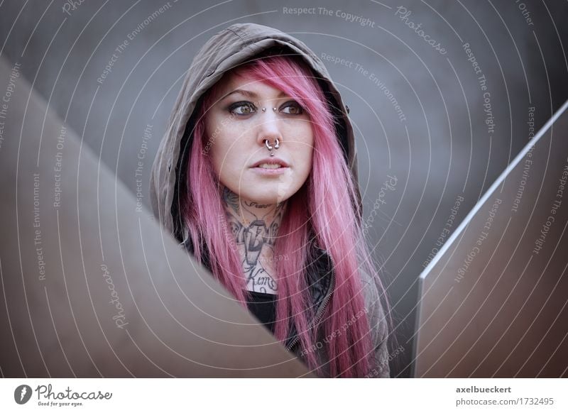 1732495-woman-with-pink-hair-piercings-and-tattoos-tattoo-photocase-stock-photo-large.jpeg