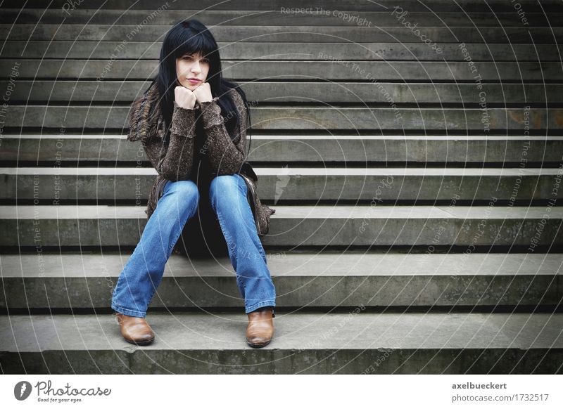 lonely woman sitting on steps Lifestyle Human being Young woman Youth (Young adults) Woman Adults 1 18 - 30 years Stairs Jeans Black-haired Long-haired Stone