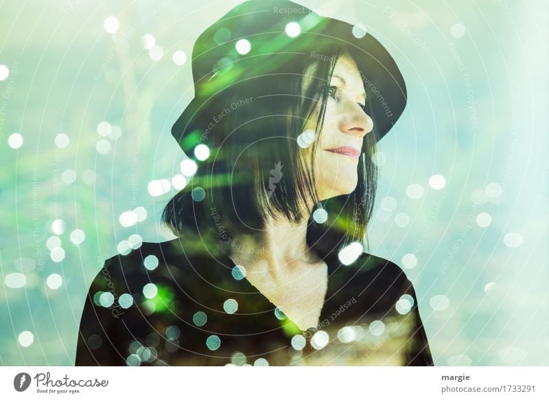 Lady in green, a young woman with hat surrounded by many lights Snow Human being Feminine Woman Adults 1 Hat Green Black Belief Dream Homesickness Wanderlust