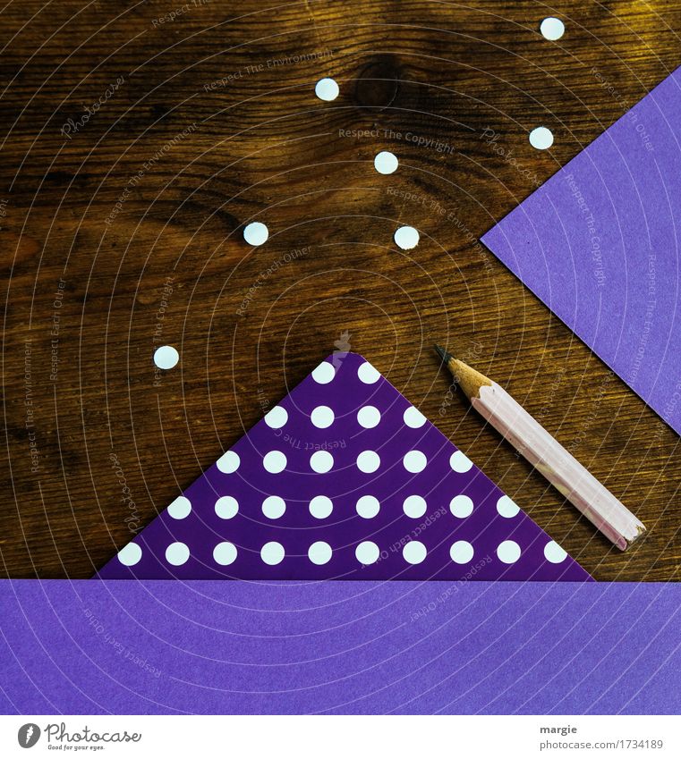 Collect points in a square: purple paper with white dots, pencil on a wooden desk Education Study Examinations and Tests Work and employment Profession