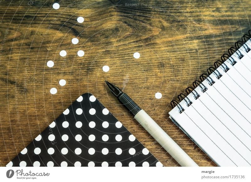 Collect points: black paper with white dots, fountain pen, and spiral pad with writing lines Study Professional training Office work Workplace