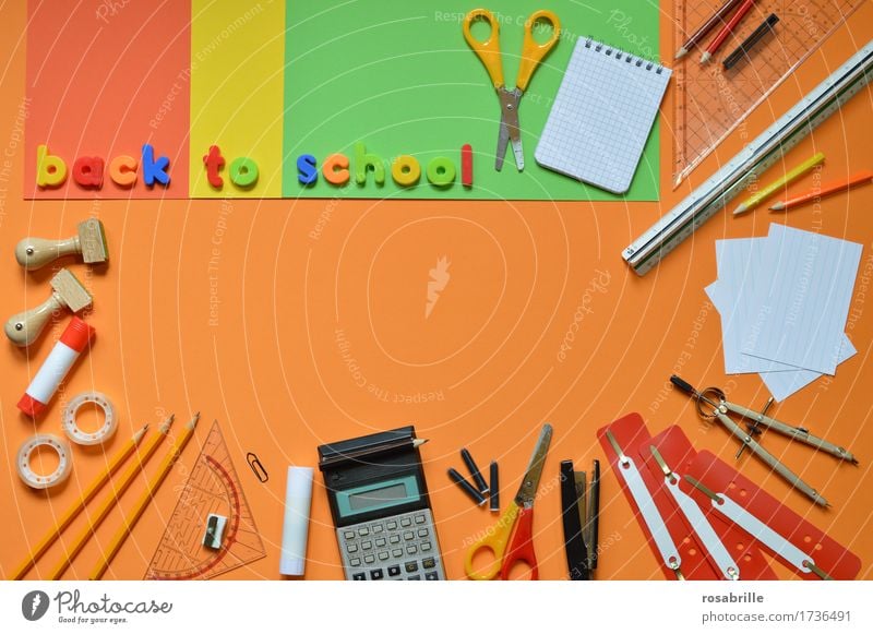 Start of school - colourful school utensils on an orange background with the words BACK TO SCHOOL Education School Study Homework Workplace Stationery Paper