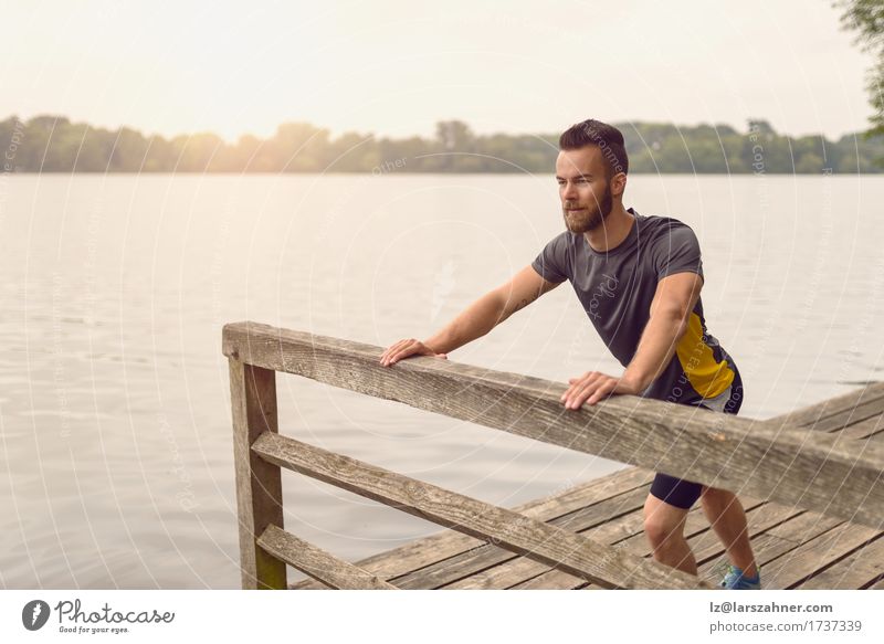 Young man doing stretching exercises Lifestyle Body Face Summer Sports Masculine Man Adults 1 Human being 18 - 30 years Youth (Young adults) Warmth Lake Beard