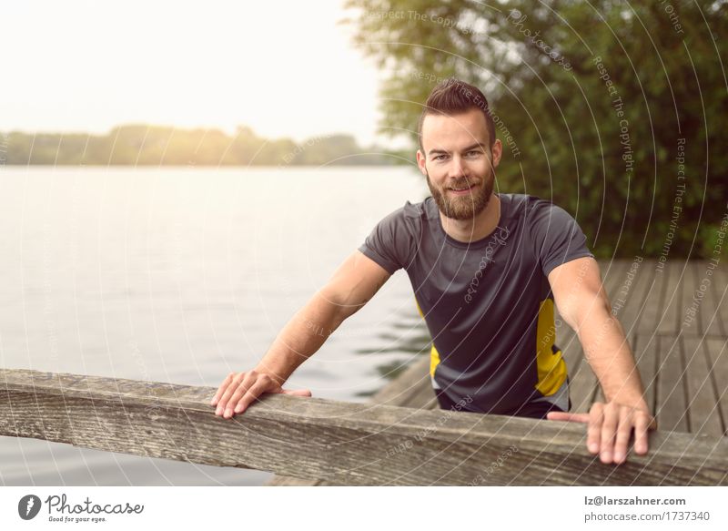 Young man doing stretching exercises Lifestyle Body Face Summer Sports Masculine Man Adults 1 Human being 18 - 30 years Youth (Young adults) Warmth Lake Beard